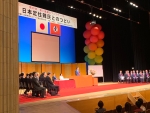 写真:共催者としてごあいさつする区長