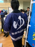 写真:新宿浴場組合の法被を着た区長